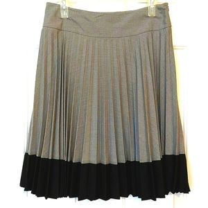 H &M women's pleated gray skirt with black banding on the bottom in US s…